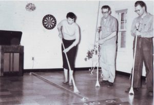 Woman playing shuffleboard